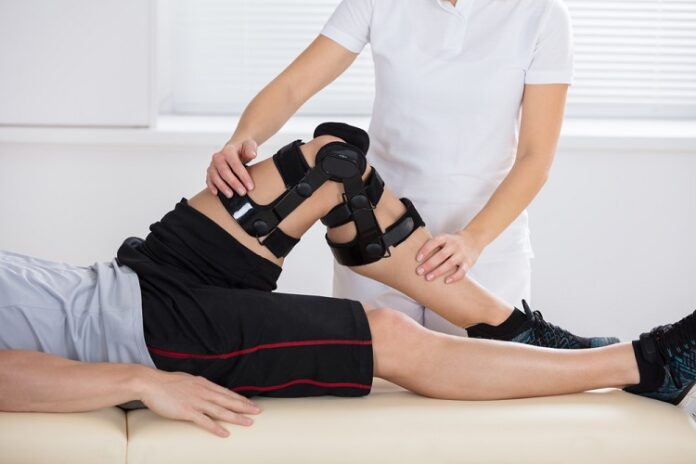Close-up,Of,A,Female,Physiotherapist,Giving,Leg,Exercise,In,Clinic Rehabilitation Specialist